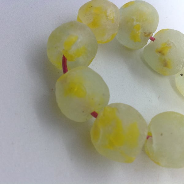 10 African round beads of clear recycled glass 13 - 15 mm, mottled with yellow