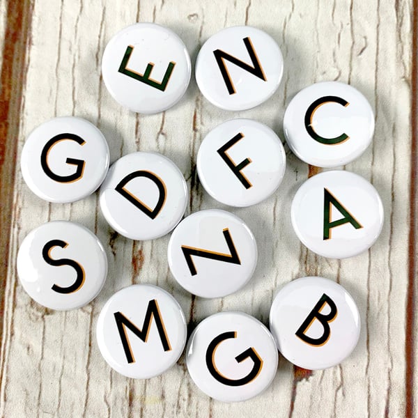 Alphabet badges black letters 'Branson' font. Two Sizes: 25mm, 38mm Pin Button