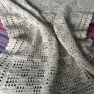 Neutral coloured crocheted blanket 