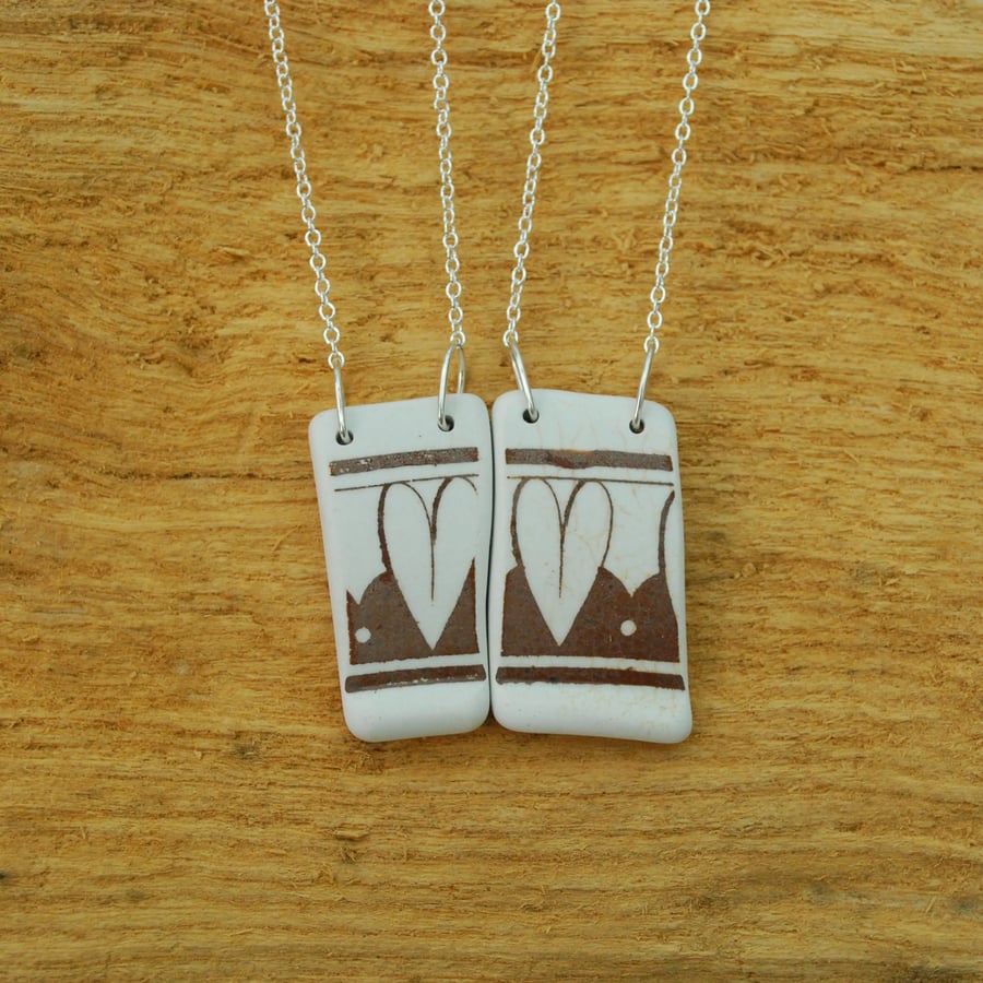Beach pottery pair of heart pendants