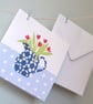 Jug of red tulips in a blue and white patterned jug on spotty tablecloth card - Image 3