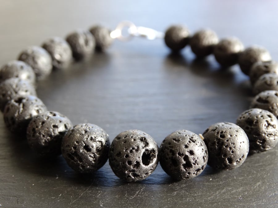 Natural lava stone beaded bracelet with sterling silver clasp.
