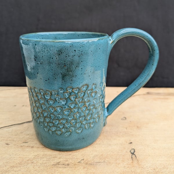 Turquoise carved mug