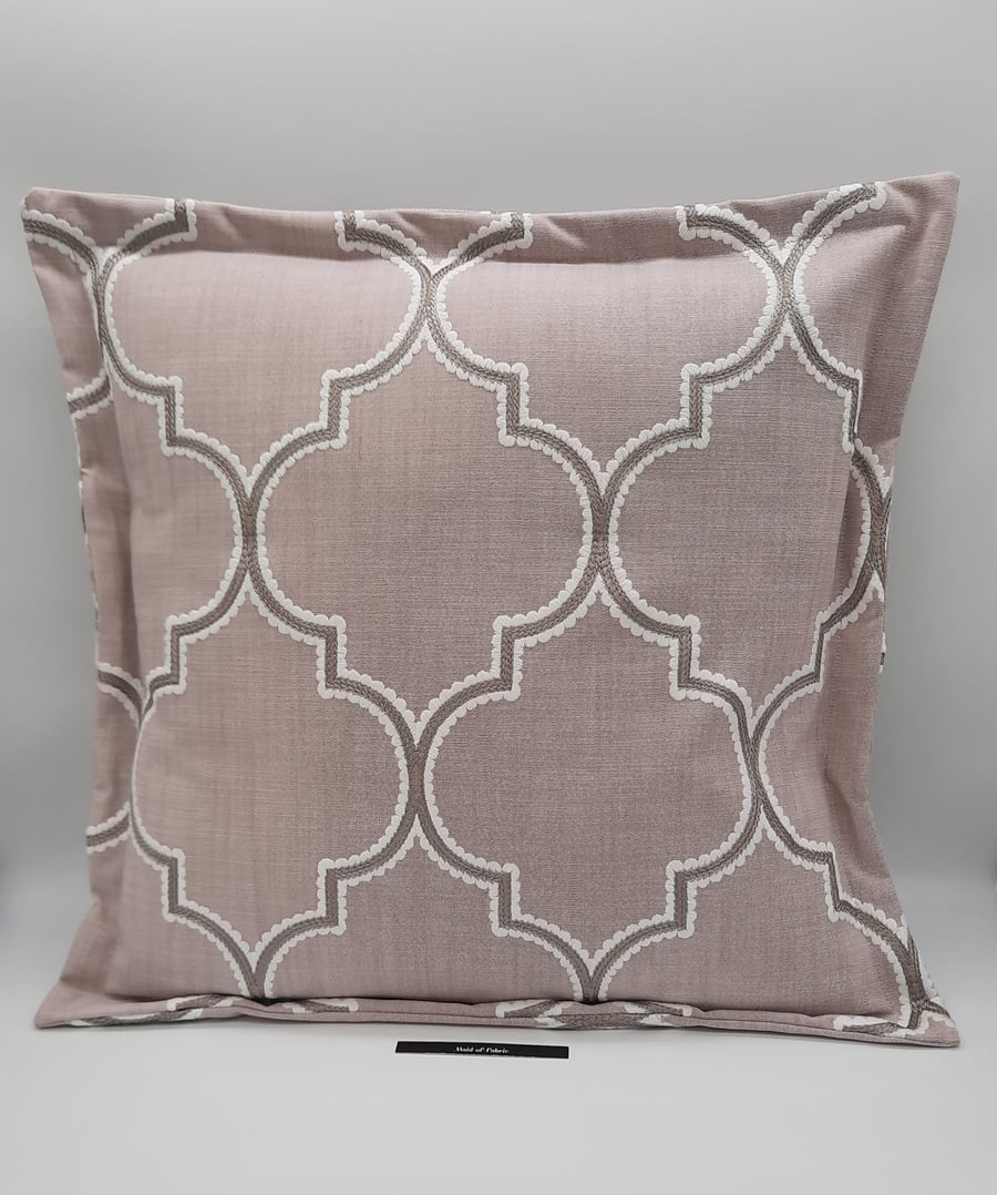 Pink embroidered flange envelope cushion cover.