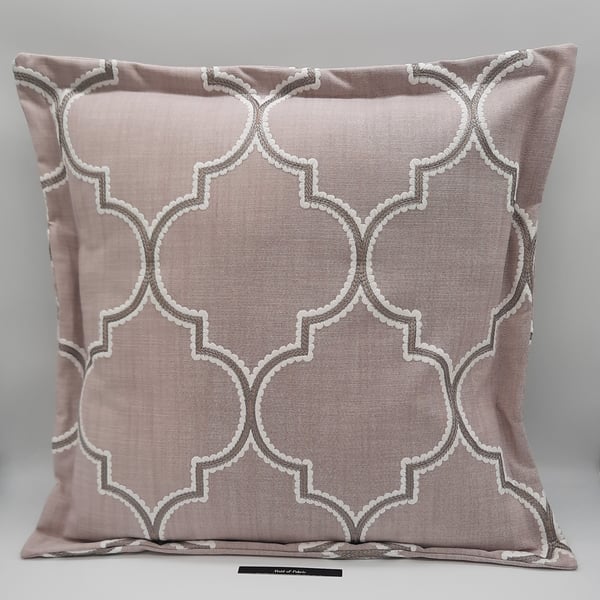 Pink embroidered flange envelope cushion cover.