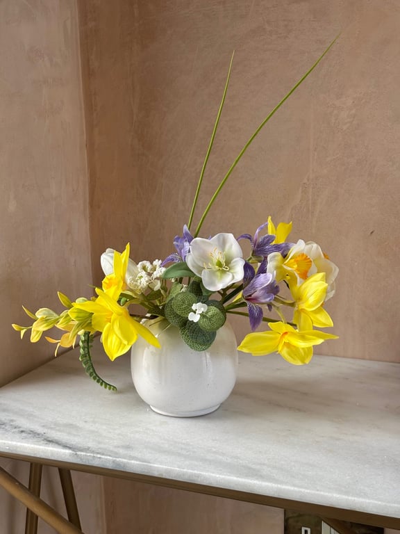 Daffodil, Hellebores and Iris in white round vase