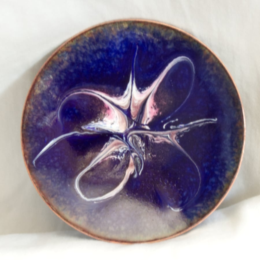 enamelled dish: scrolled white and pink on blue over clear