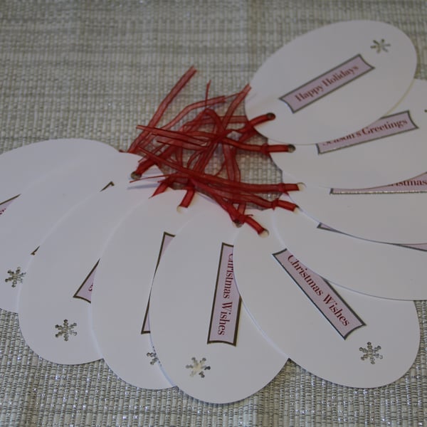 10 Oval Christmas Gift tags, snowflake aperture & coloured printed greeting