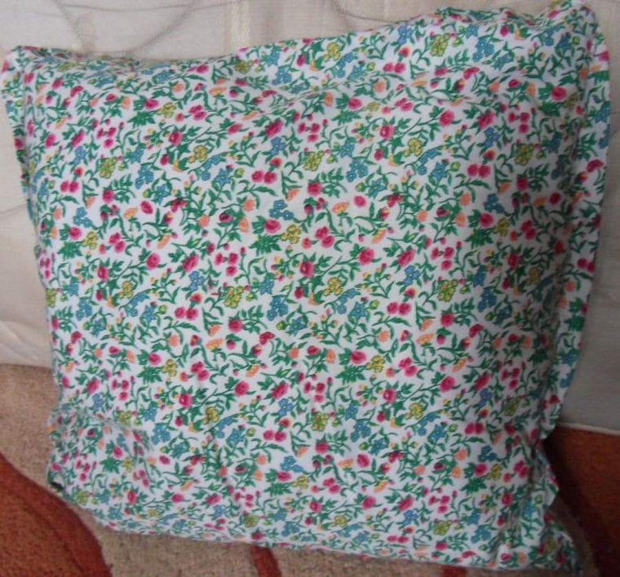 Homemade Pink flowers on a white background cushion.