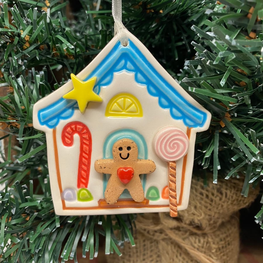 Extra fancy Pottery Gingerbread house decoration with teeny gingerbread man