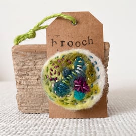 Needle felted hand embroidered circular brooch 