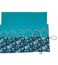 Circular needle case made from Liberty floral fabric, fixed circular sock needle
