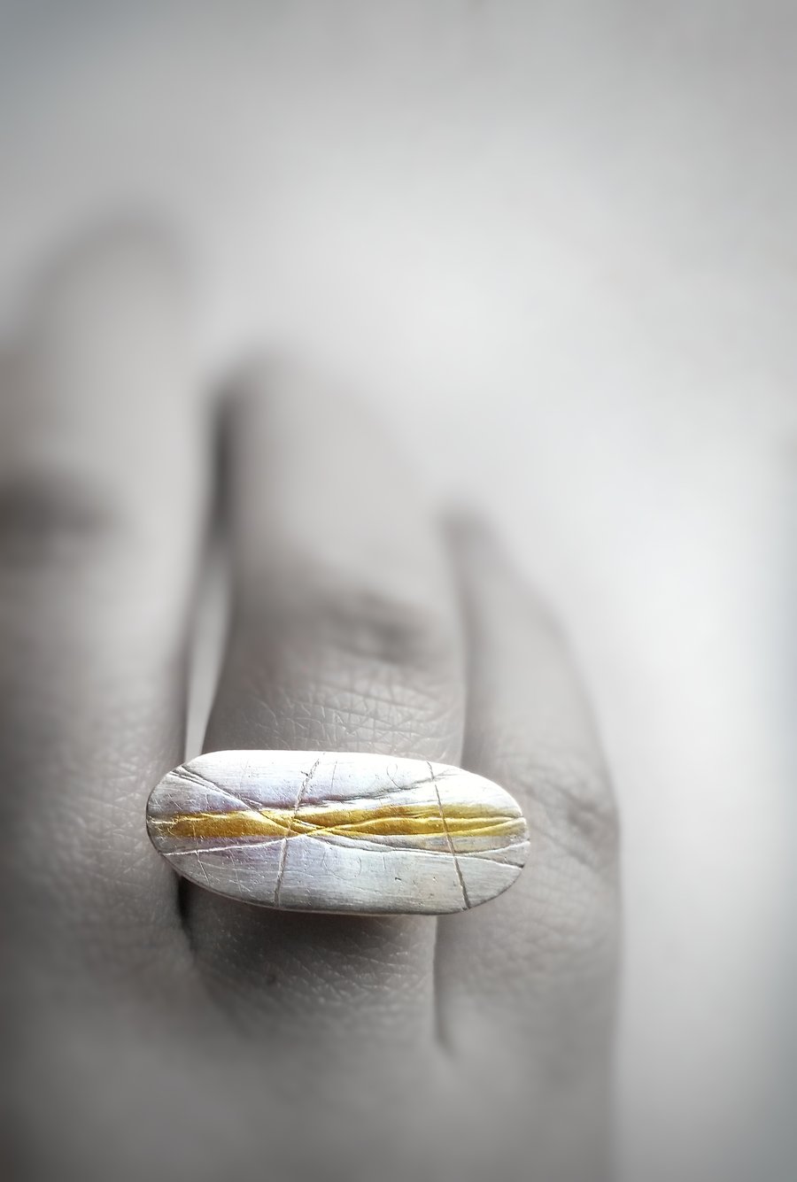 Organic feel adjustable textured silver ring with gold highlight.  UK handmade 