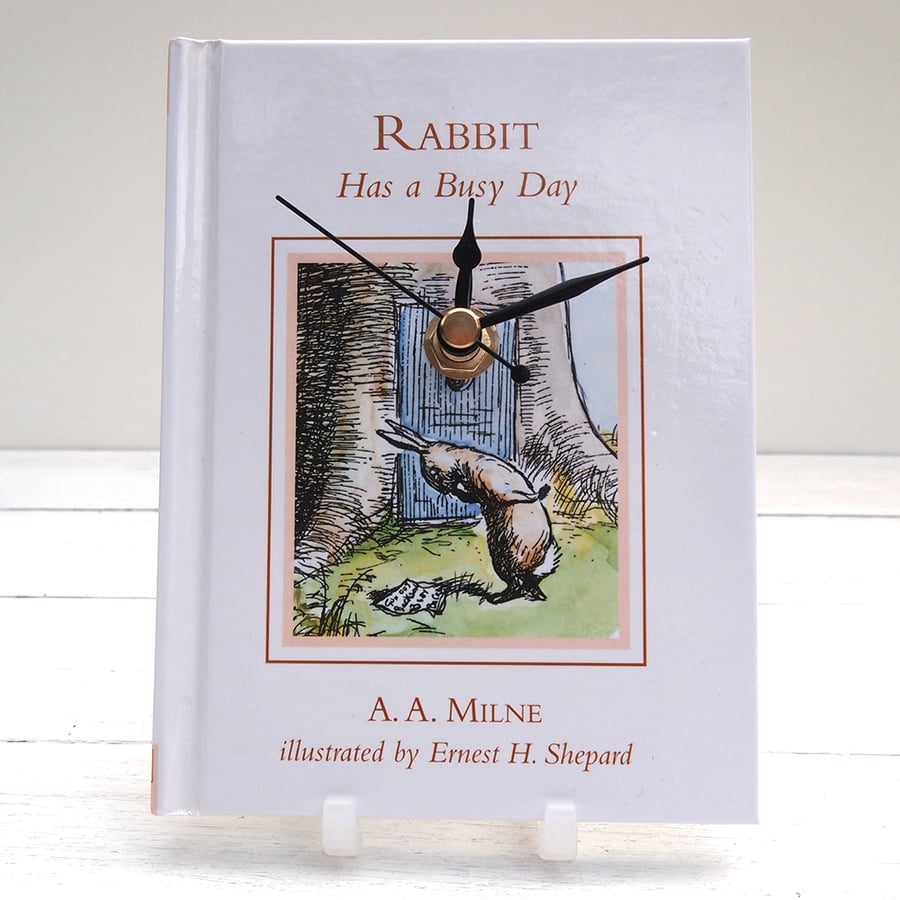 Winnie The Pooh book clock, featuring Rabbit Has a Busy Day by A. A. Milne.