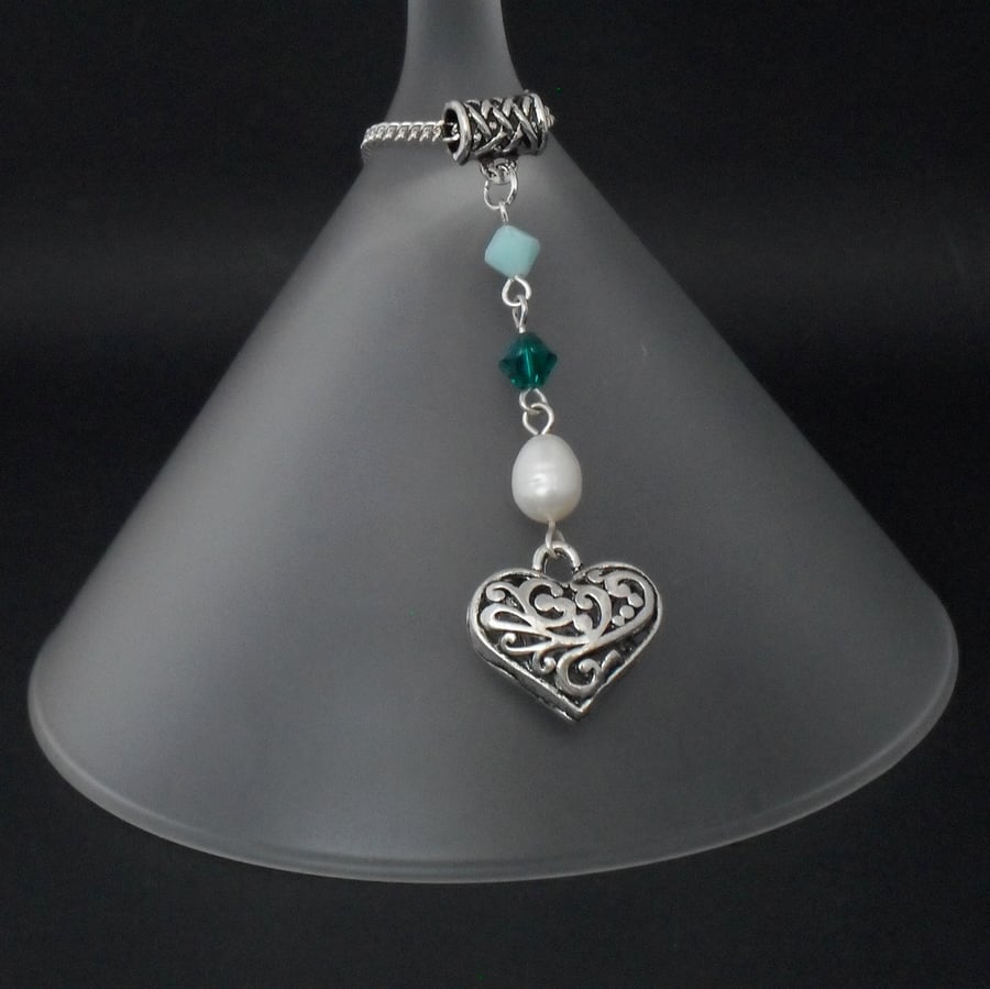 Pearl & tibetan silver heart charm necklace with green swarovski elements