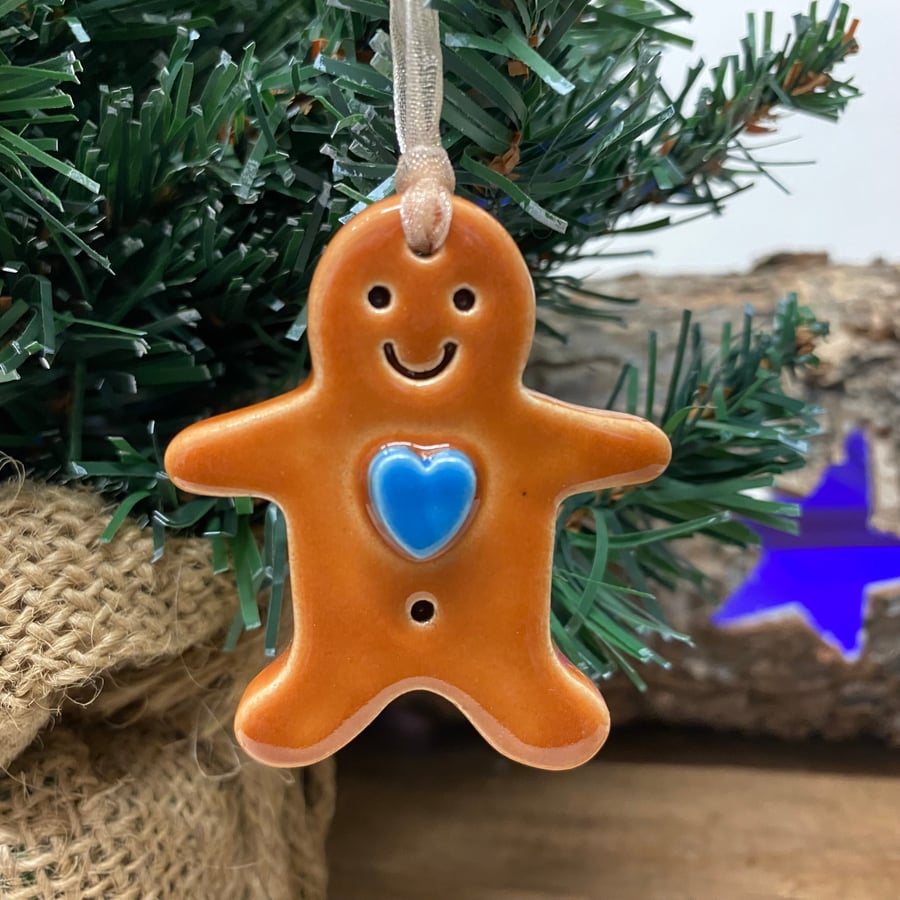Small pottery gingerbread man with blue heart