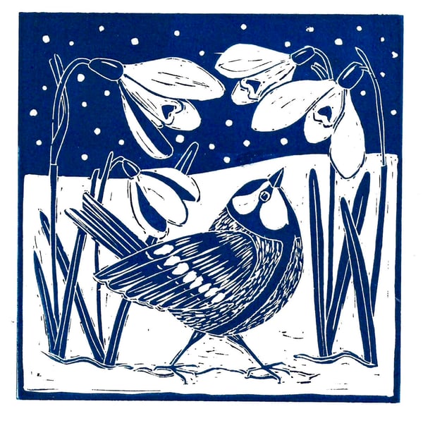 A freshly printed linocut card featuring snowdrops and a Great Tit