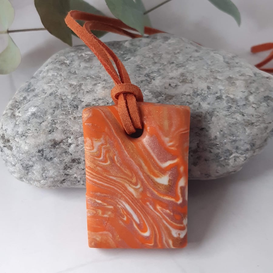 Bright orange rectangular polymer clay pendant 