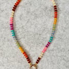 Colourful beaded necklace with heart pendant 