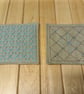 Set of four beige linen coasters with sashiko embroidery detail - Image 4