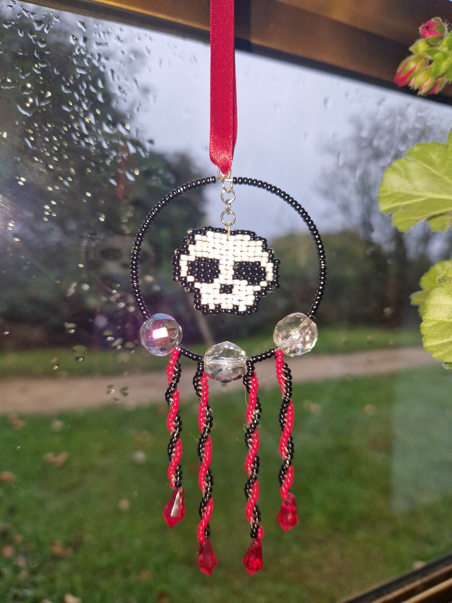 Red white and black beaded skull hanging decoration