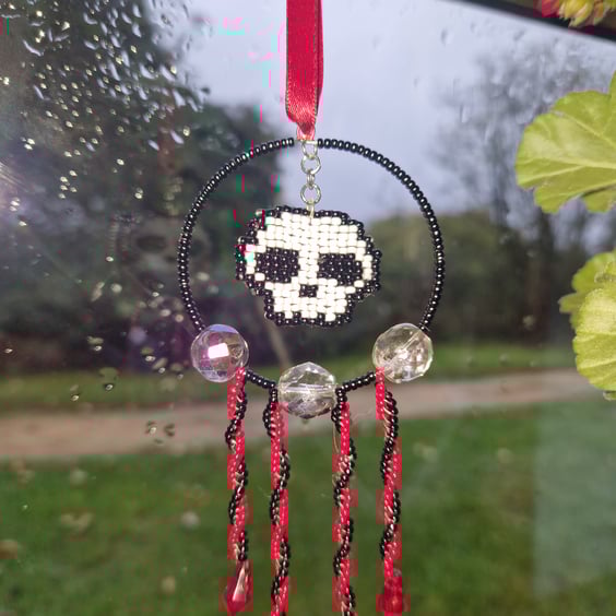 Red white and black beaded skull hanging decoration