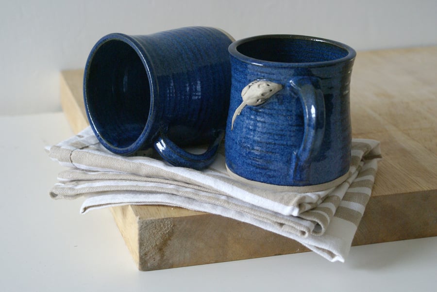 Two stoneware pottery coffee mugs - glazed in midnight blue with tiny mouse