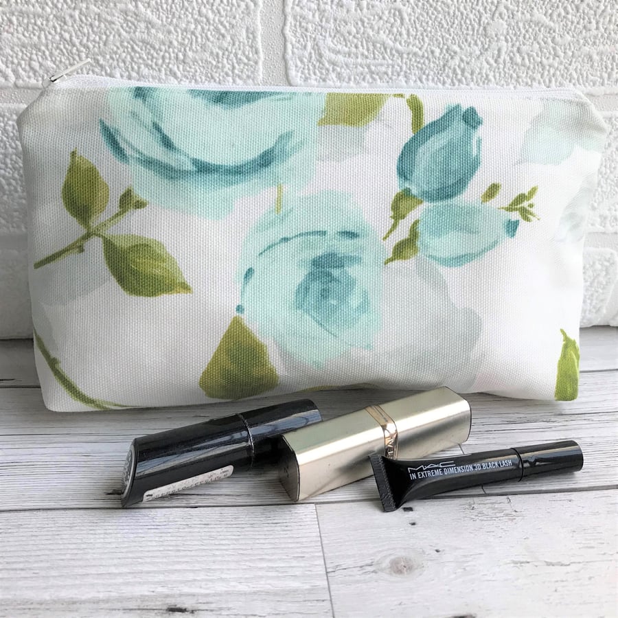 Cosmetic bag, make up bag in cream with pale blue roses and rosebuds