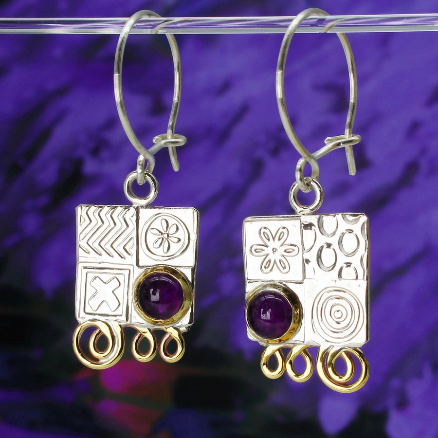 Handmade sterling silver earrings featuring Amethyst gemstones and hoops. M.S.