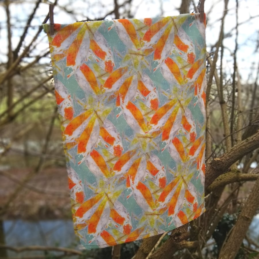 Handmade tea towel with abstracted fish design