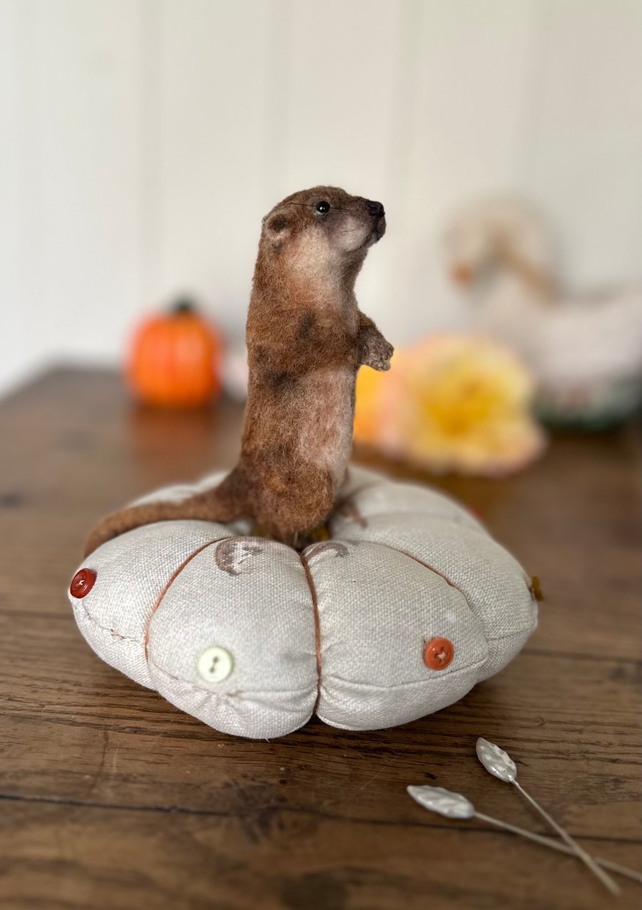 Needle felted otter pincushion. 