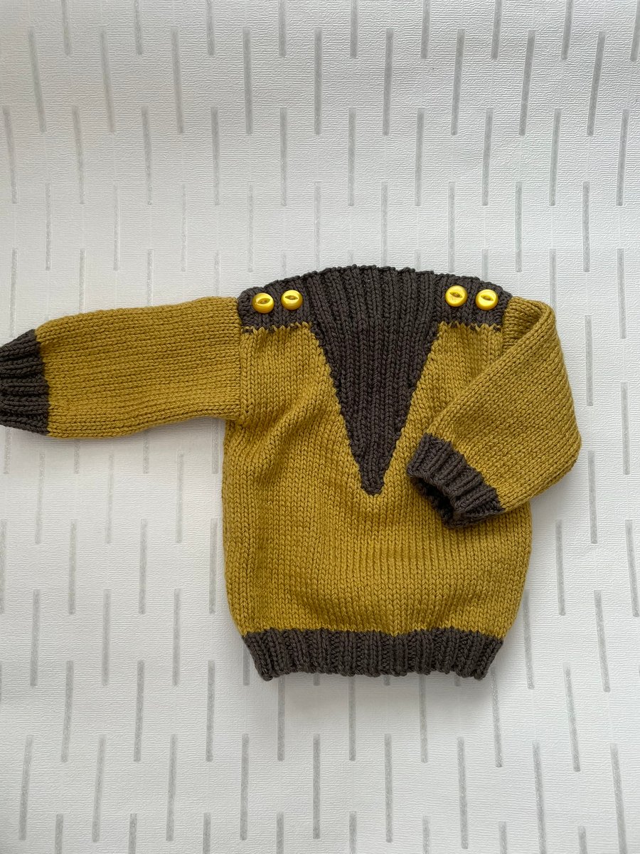 Aran weight jumper with V shaped insert