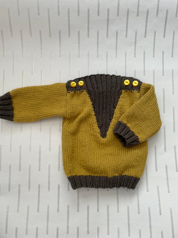 Aran weight jumper with V shaped insert