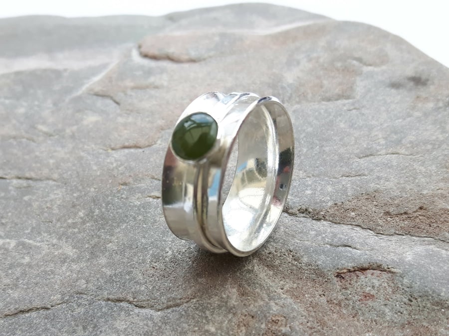 Sterling silver spinner ring with green nephrite jade gemstone