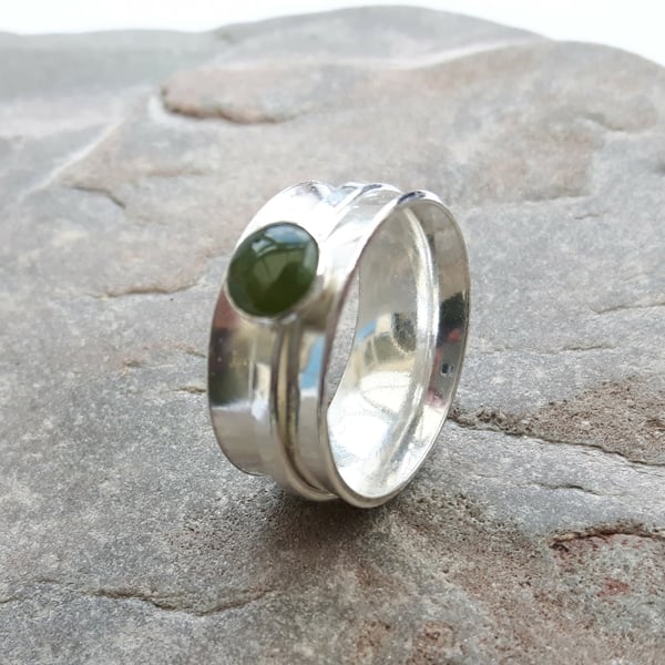 Sterling silver spinner ring with green nephrite jade gemstone