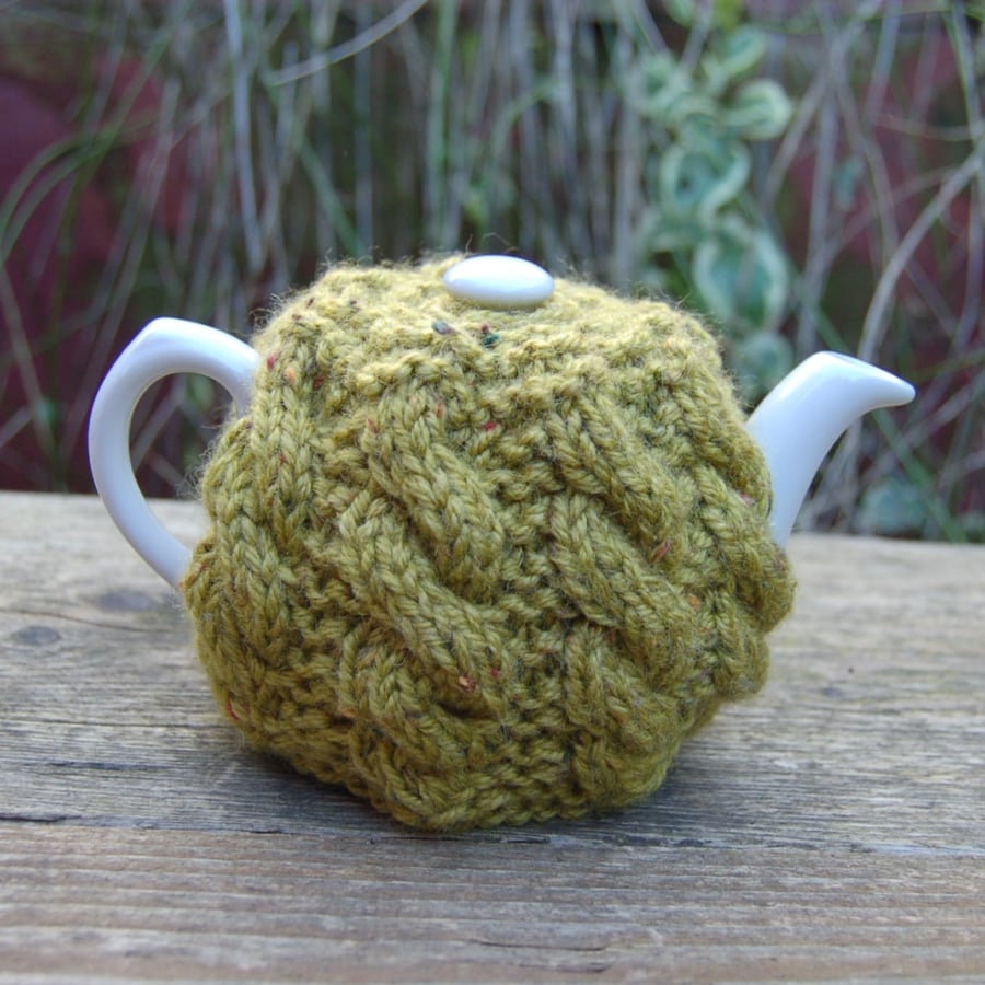 Small tea cosy cable design in olive green wool mix yarn hand knitted tea cosy 