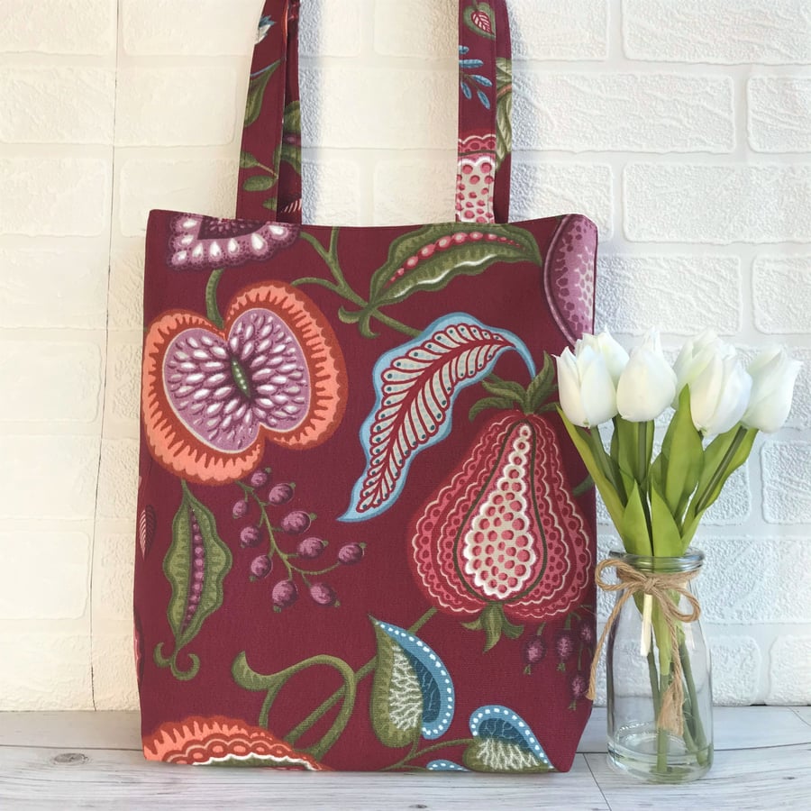 Tote bag with stylised fruit and foliage print in burgundy, pink and terracotta