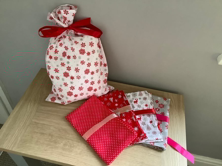 Reusable fabric gift bags.