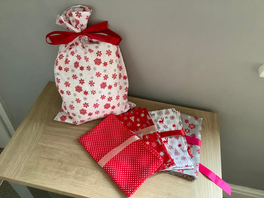 Reusable fabric gift bags.