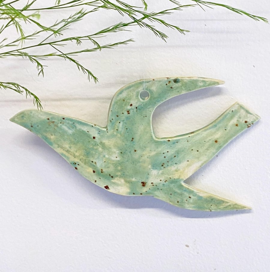 Hanging bird ceramic decoration- hand glazed in blues and greens 16cm