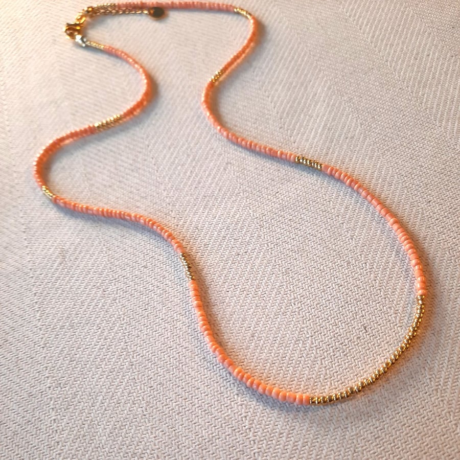 Glass beaded necklace, peach and gold, 20 to 22 inches