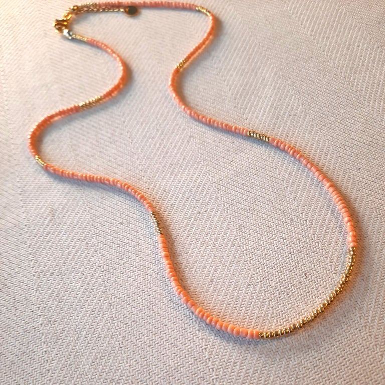 Glass beaded necklace, peach and gold, 20 to 22 inches