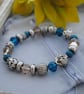 Silver and blue bead stretch bracelet - Image 5