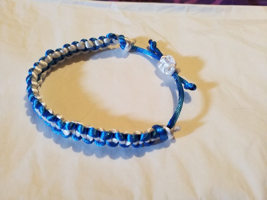 Handmade blue and white reversible, adjustable macrame bracelet 