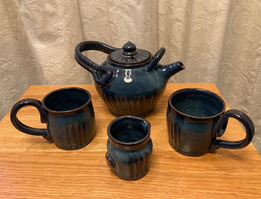Tea for two!  Teapot, 2 mugs and pourer