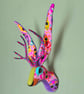 Faux jackalope head wall mount in Day of the Dead skull style fabric