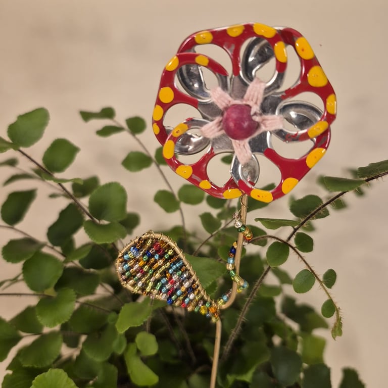 Red w yellow spots, silver & pink flower plant companion perfect for pot plants