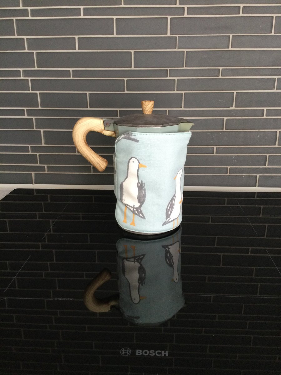 Seagull print canvas cotton padded cafetiere cosy. Self lined and hook and loop.