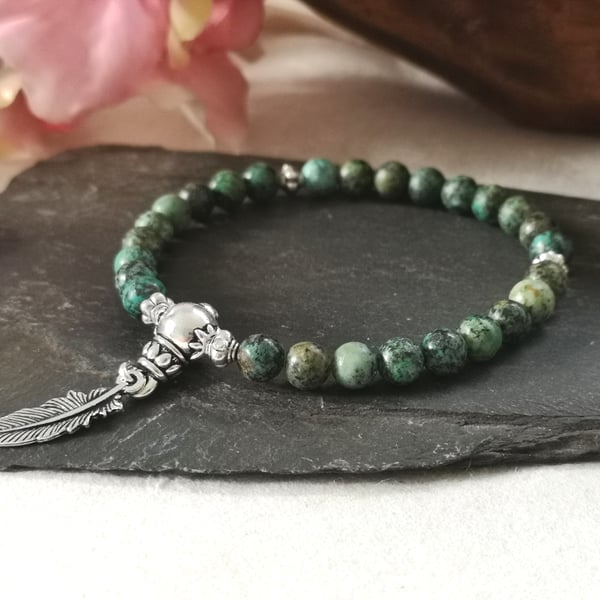 African turquoise 27 mala bead stretch bracelet with feather charm