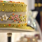 ORNATELY DECORATED TOP HAT TO DESPLAY AND BEAUTIFY THE HOME